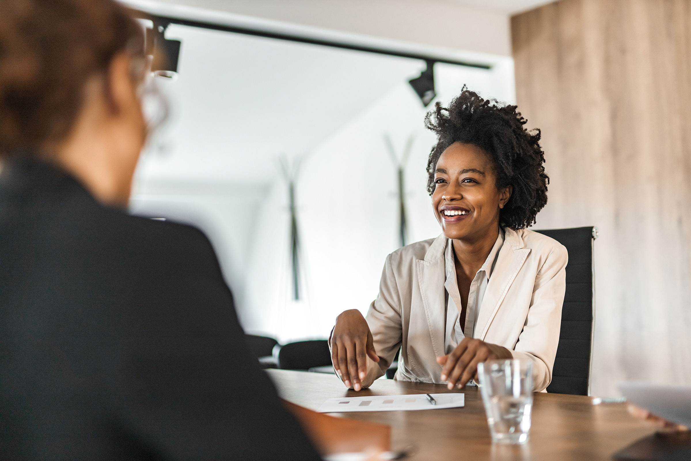 Two women meeting at a desk