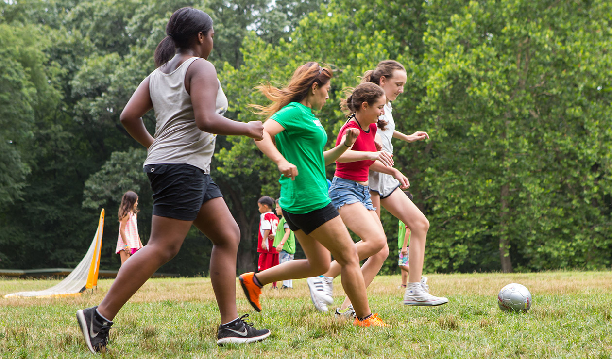 Teenage girls playing soccer